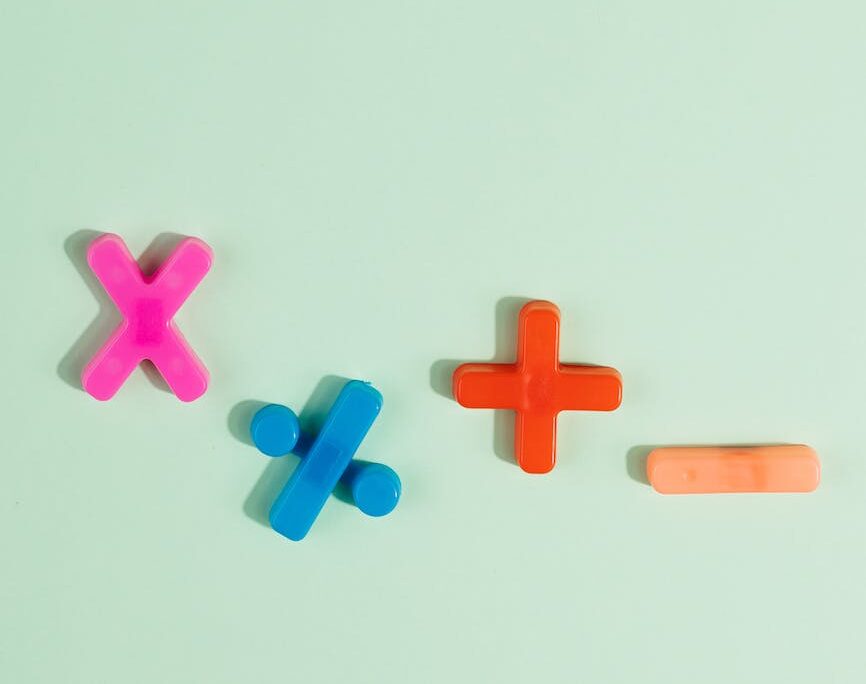 math symbols in various colors on blue surface